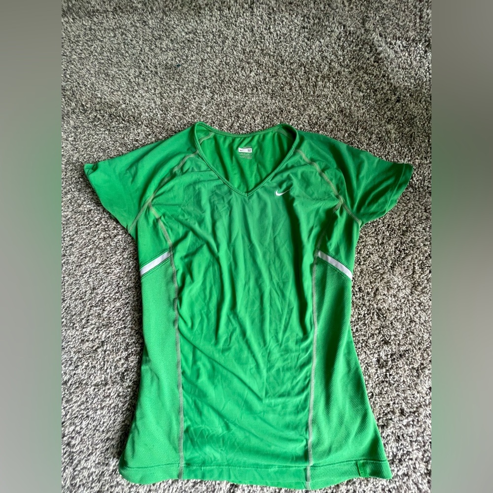 Nike Woman’s Athletic top in gently used condition Sz M